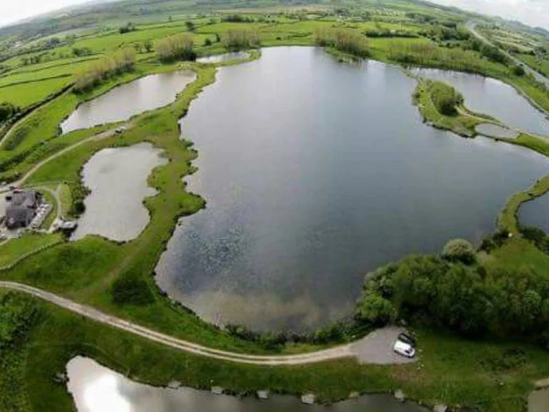 A scenic view of the expansive Karnforth Lake at Clearwater Fisheries