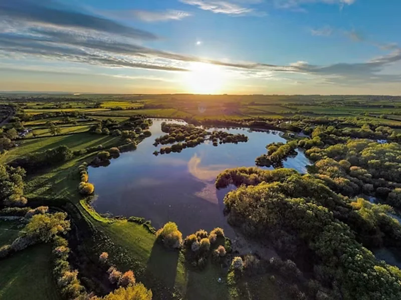 A scenic view of Frisby Lakes, a challenging carp fishery in Leicestershire.