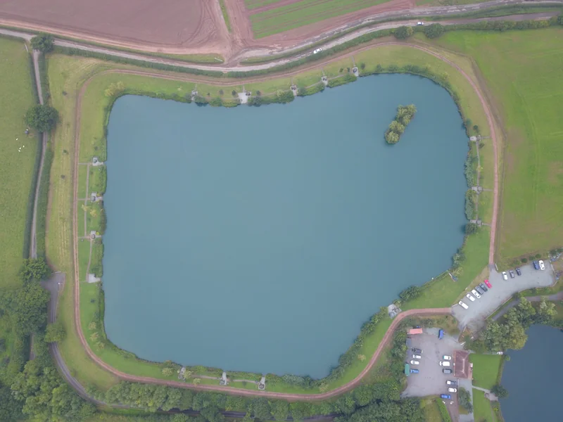 Monument 2 lake at RH Fisheries showing the 10-acre day ticket carp fishery with 18 swims including double pegs and electric hook-ups