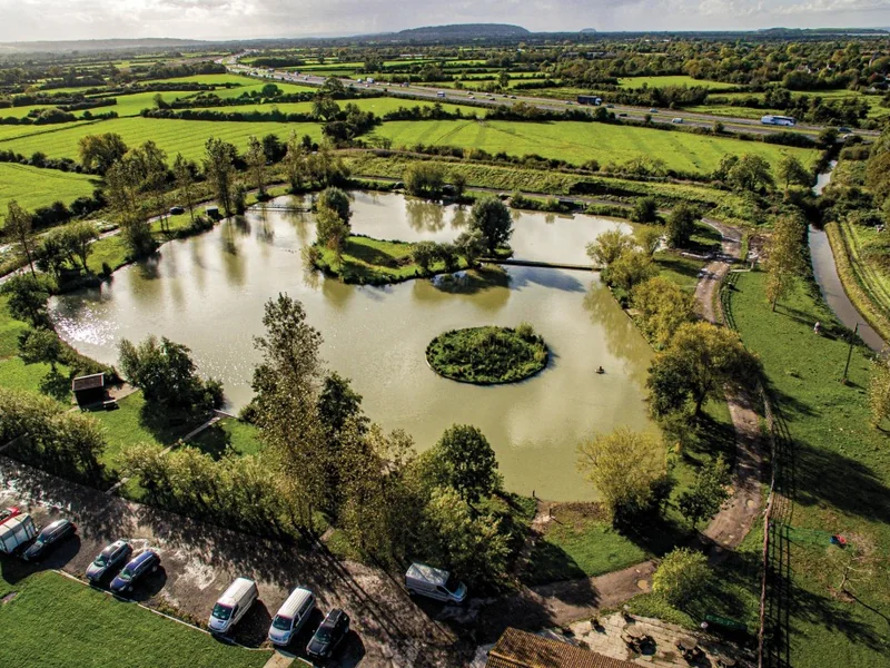 A scenic view of Acorn Lake at Acorn Carp Fishery.