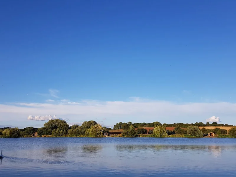 A scenic view of The Quarry at Baden Hall Fishery, a premier specimen carp lake in Staffordshire.